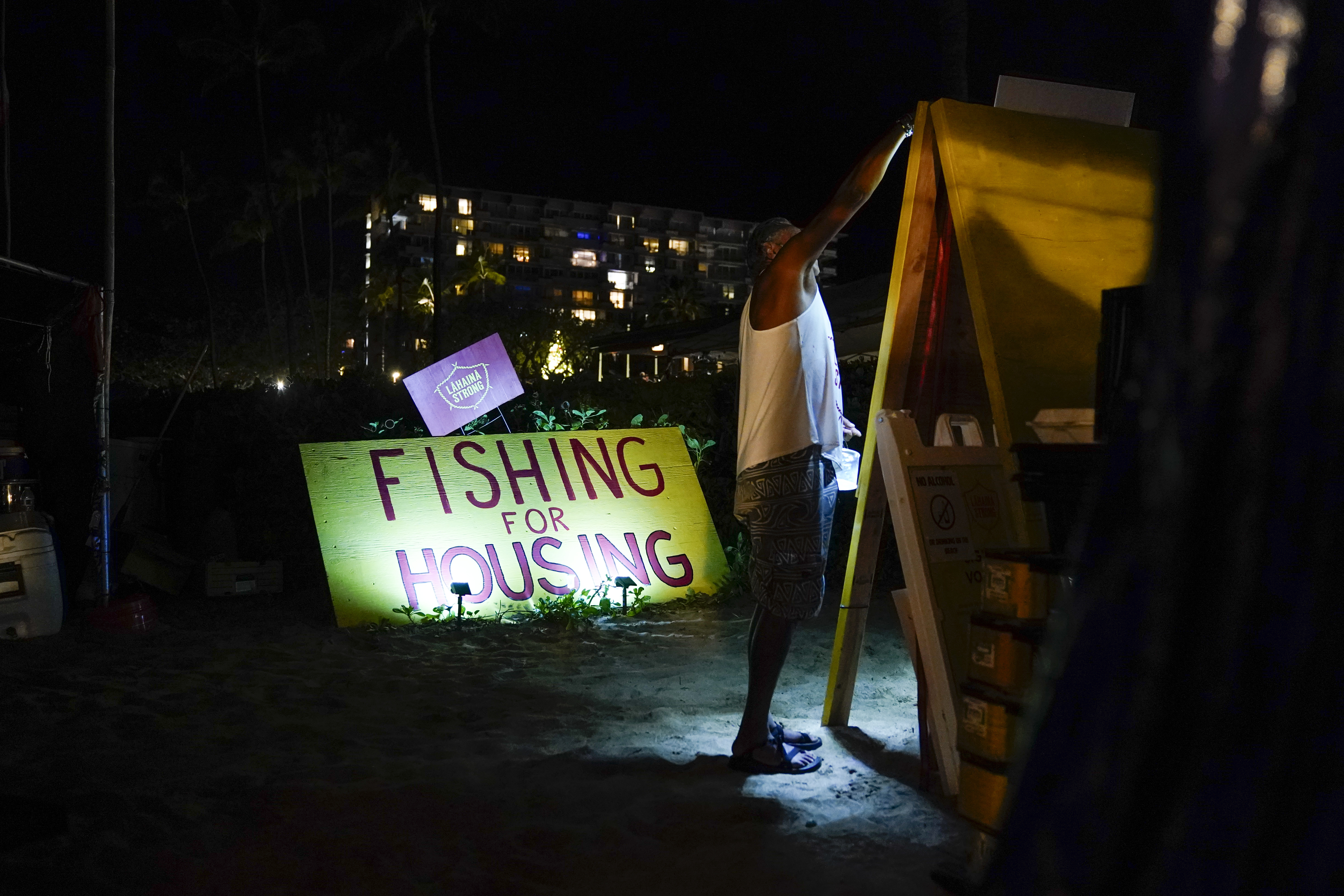 Naldo Valentine, who lost his home in the Lahaina wildfire, attends a housing protest in December. Naldo Valentine, who lost his home in the Lahaina wildfire, attends a housing protest in December.